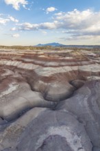 Striking aerial photograph capturing the multi-colored, layered bentonite hills in the rugged