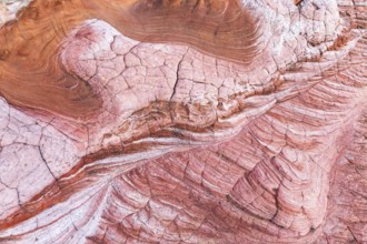 Discover the striking abstract formations and vibrant colors of desert rock textures at Vermilion