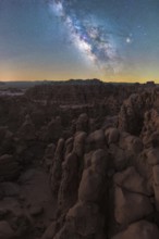 Captivating night sky illuminates the unique rock formations of Goblin Valley State Park in Utah,