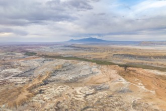 A stunning aerial drone view capturing the vast, rugged landscape of Hanksville, Utah, highlighting