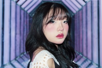 An Asian Gen Z girl with creative makeup explores a bright and vibrant arcade, embracing the lively