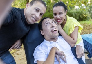 Spanish Cameroonian siblings enjoying a moment outdoors. The family shares a joyful connection,
