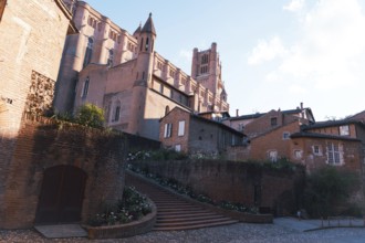 A striking view of a medieval Berbie Palace under a bright, clear sky in Albi, France The image