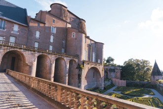A stunning Berbie Palace exhibits grand architecture, with robust arches and detailed balconies in