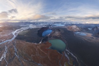 Captivating aerial view of Iceland's Highlands showcasing volcanic craters, vivid blue lakes, and