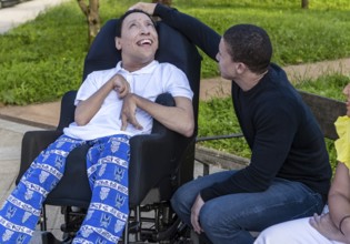 A heartwarming scene of Cameroonian and Spanish mixed-race siblings enjoying outdoor time. One