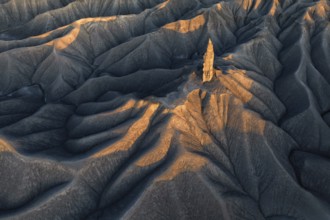 A striking aerial view of the textured terrain of Caineville Mesa near Hanksville, Utah, bathed in