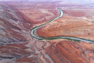 Aerial view of the serpentine Rio San Juan meandering through the stark red canyon landscapes of