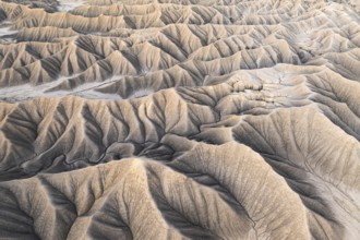 Aerial shot captures the intricate natural patterns and textures of Caineville Mesa near Hanksville