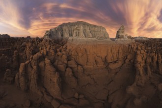 Aerial view capturing the stunning sunset skies over Goblin Valley State Park, Utah, showcasing