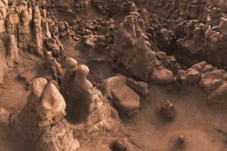 Capture the eerie and fantastical landscape of Goblin Valley State Park in Utah, USA. This image