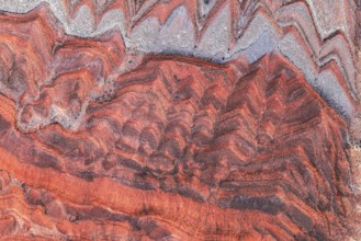 Striking aerial image capturing the rich, red and gray patterns of rock formations along the San