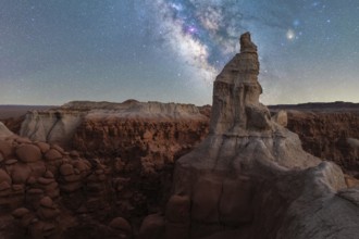 A breathtaking view of the Milky Way illuminating towering sandstone formations in Goblin Valley