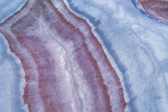 Aerial view of vibrant multicolored sandstone formations offering a stunning display of natural