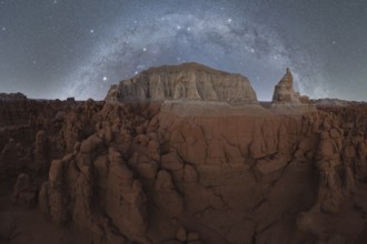 Majestic night sky filled with stars and the Milky Way above the unique sandstone formations of