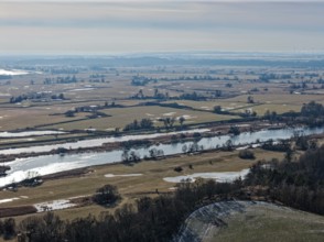 Ice and snow-covered foothills of the Oder in the Lower Oder Valley National Park. aerial view.