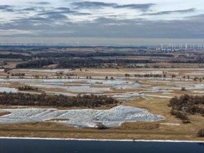 Ice and snow-covered foothills of the Oder in the Lower Oder Valley National Park. aerial view.