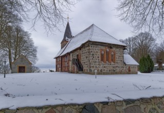 Lassahn village church in the snow in the Schaalsee UNESCO Biosphere Reserve. Lassahn,