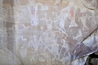 Abstracted figures and symbols as petroglyphs from the Fremont culture on a stone surface, Dinosaur