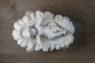 I'm standing at your crib here, wooden crib figure, the birth of Jesus Christ Child lying in a crib