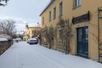 Historic wine house and the Meinholdschen Weingut and Meinholdsches Turmhaus in the snow, today