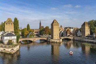 The towers of the Ponts Couverts Covered Bridges on the Ill and the cathedral in Strasbourg,