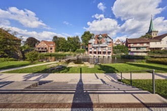 Mühlenstever, Stever river, houses, residential buildings, church tower of St. Felizitas, green
