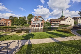 Mühlenstever, Stever river, houses, residential buildings, church tower of St. Felizitas, green