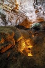Underground cave formed by lava flow, illuminated lava tunnel, Cueva de los Verdes, Lanzarote,