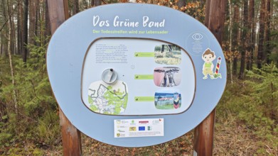 Information sign about the Green Belt in a wooded area, hiking on the former inner-German border on