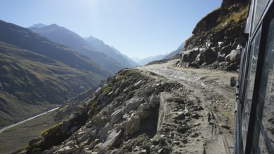 Drive along a remote mountain road with sweeping views in bright sunshine, Manali-Leh Highway, Leh,