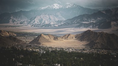 Colorful landscape with mountains and a sun-drenched valley, trekking in Ladakh, Stok la,