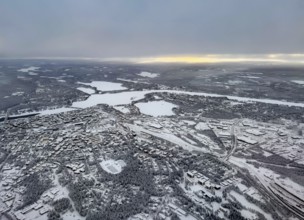 View of the snowy town of Rovaniemi with the Kemijoki river, in winter, aerial view, Finland