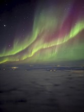 Northern lights, aurora borealis, aerial view from an airplane, Finland