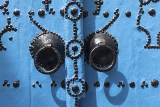 Detail of beautiful blue ornate door in the narrow streets of Tunis Medina, the historical Kasbah