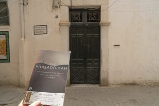 A copy of The Maqaddimah, classic Islamic history written by Arab philosopher Ibn Khaldun outside
