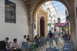 Tunis, Tunisia. 29th May 2024 Young Tunisians and tourists enjoy the café culture in the alleyways