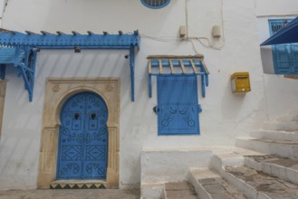 Authentic blue coloured architecture of the Tunisian cliff top village of Sidi Bou Said,