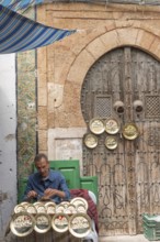 Tunis, Tunisia. 2nd May 2024 A local Tunisian craftsman at work in the Medina, a busy market