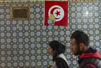 Tunis, Tunisia 2nd May, 2024 Typical Tunisian decorated wall of a restaurant with a Tunisian flag