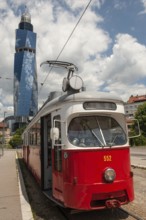 Sarajevo, Bosnia and Herzegovina July 25th 2019. An old tram waits at a tram stop with the Avaz
