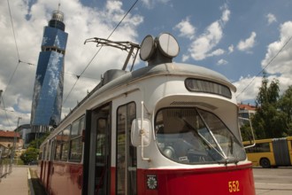 Sarajevo, Bosnia and Herzegovina July 25th 2019. An old tram waits at a tram stop with the Avaz