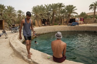 Siwa Oasis, Egypt. April 12th 2018. Young Egyptian men hang out and swim at Cleopatras Pool, Siwa