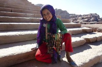 Petra, Jordan. December 13th 2012 Jordanian Bedouin girl selling beads to tourists Petra Jordan