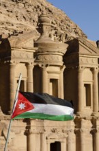 Petra, Jordan. December 11th 2012 The Jordanian flag fluttering in front of The Monastery, El Deir,