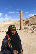 Petra, Jordan. December 11th 2012. A Jordanian Bedouin woman near a monument known as the Pharaohs
