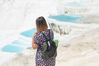 Pamakkule, Turkey, April 25th 2020 Pamakkule, Turkey, April 25th 2020 A tourist carrying her shoes