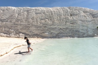 Pamukkale, Turkey, April 25th 2020 A young tourist having fun in the thermal waters of the
