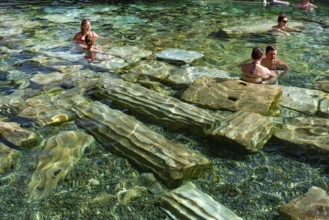Pamukkale, Turkey, April 25th 2020 Foreign tourists enjoys the healing properties of thermal waters