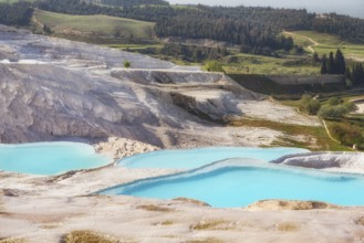 Pamukkale Travertine Terraces, amazing aqua blue pools of thermal mineral-rich spring water set